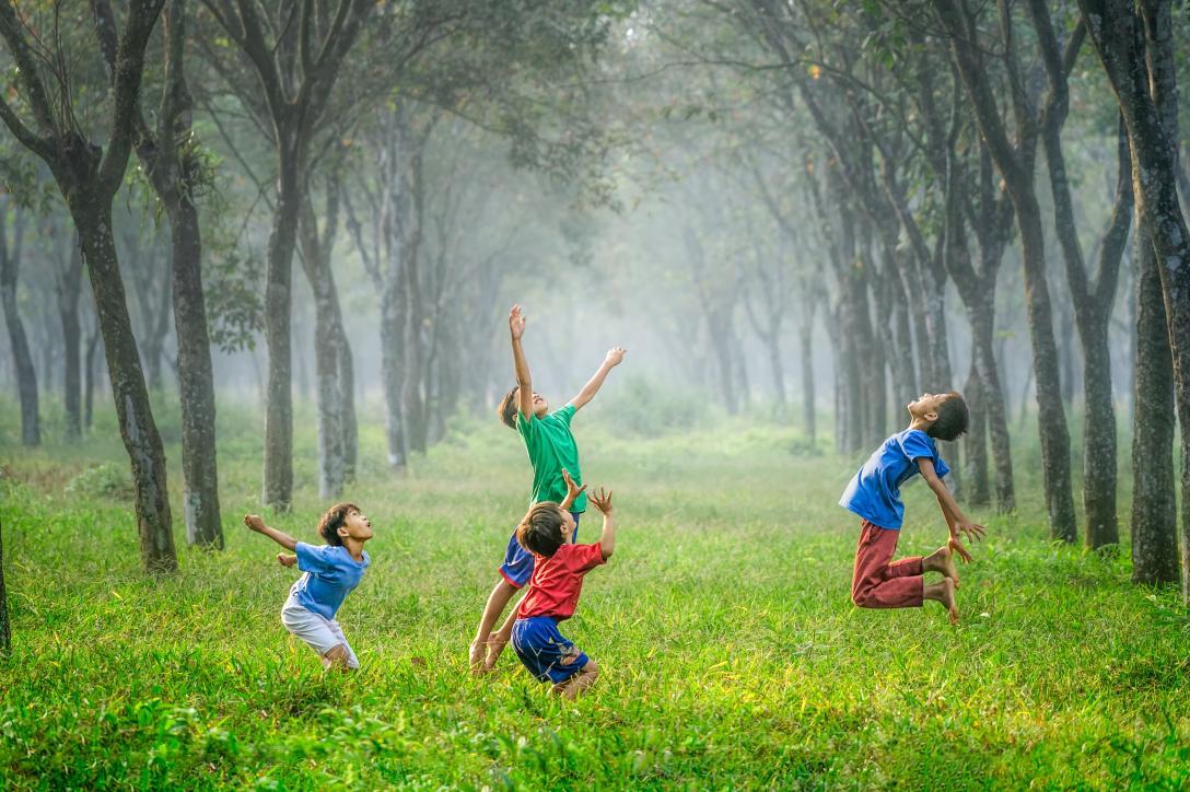 Kids Jumping in a Field - Unsplash