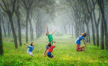 Kids Jumping in a Field - Unsplash